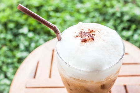 Refreshing glass of iced blended espresso with milk foamの写真素材