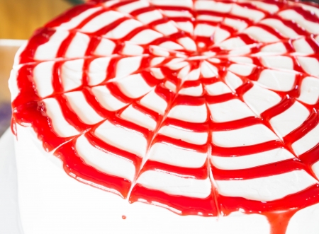 Fresh whipped cream cake decorated raspberry sauceの写真素材