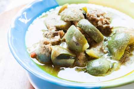 A bowl of spicy green curry, thai traditional foodの写真素材
