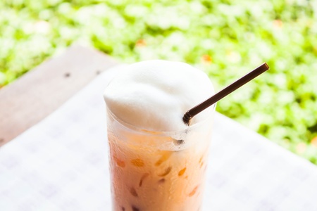 Break time with cold thai milk teaの写真素材