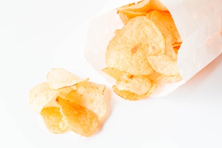 Potato chips snack falling out of the pack