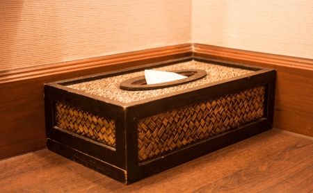 Facial tissue paper in craft box on wood tableの写真素材