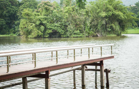 Metal bridge into the water, stock photoの写真素材