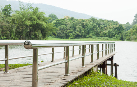 Metal bridge into the lake, stock photoの写真素材