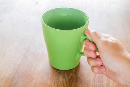 Hand hold coffee ceramic cup, stock photoの写真素材
