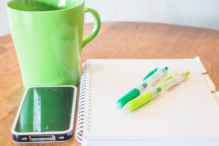 Creative work table with hot mug, stock photoの写真素材