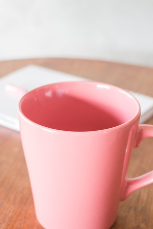 Beautiful pink ceramic mug of hot drink, stock photoの写真素材