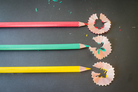 Multi color pencils shavings on dark backgroundの写真素材