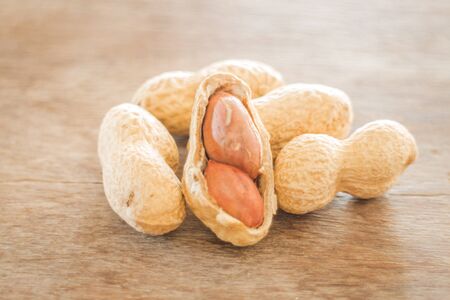 Salted peanuts on weathered wood