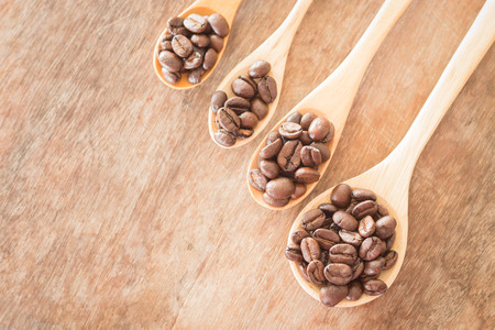 Coffee spoons on grunge wooden table, stock photoの写真素材