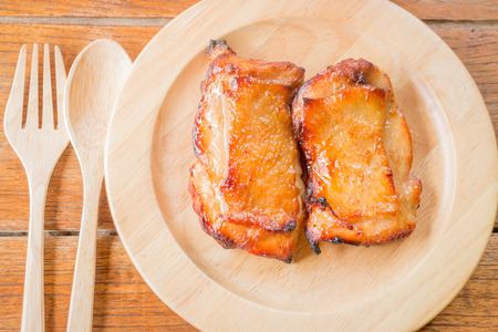 Chicken grilled steak on wooden plateの写真素材