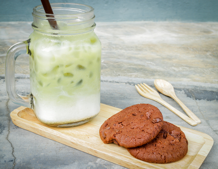 Iced green tea latte and chocolate cookies, stock photoの写真素材