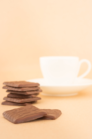 White mug of hot coffee and chocolate pieces, stock photoの写真素材