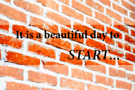 It is a beautiful day to start quote on blur vintage brick wallの写真素材