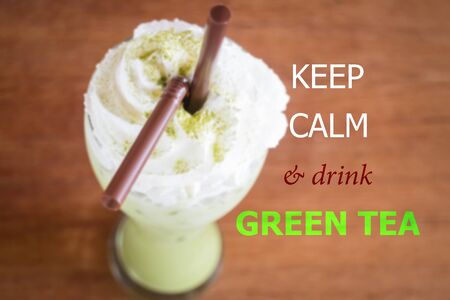 Keep calm and drink green tea quote on blur backgroundの写真素材
