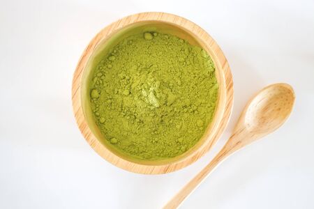 Premium green tea powder in wooden bowl, stock photoの写真素材
