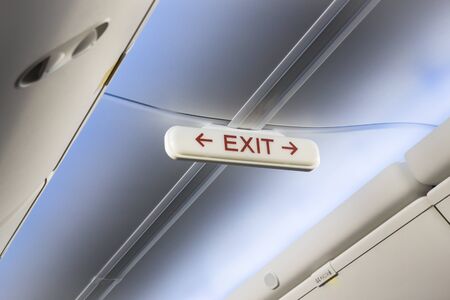 Airplane cabin interior exit sign, stock photoの写真素材