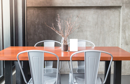 Mock up frame on table in bar restaurant cafe, stock photo