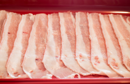 Raw sliced pork preparing for homemade sukiyaki, stock photoの写真素材