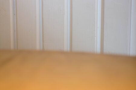 Empty wooden table over white wall, stock photoの写真素材