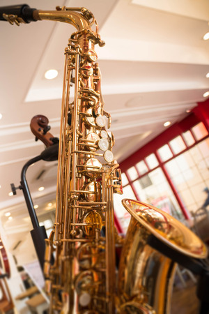 Golden saxophone show in the shop, stok photoの写真素材