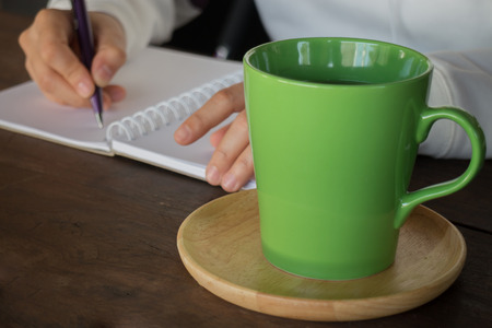 Working creative table and hot green tea drinking, stock photoの写真素材