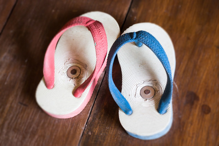 Little Slippers On Wooden Boardの写真素材
