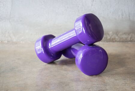 Violet Dumbbell Weights On Grey Background, stock photoの写真素材