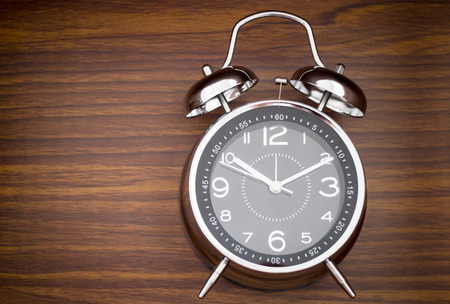 Alarm Clock On Wooden Background,