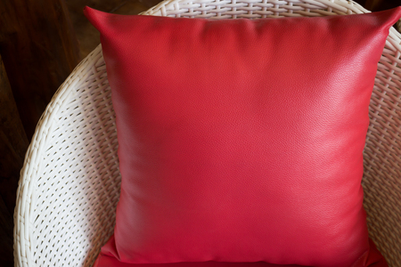 Red Pillow With Plastic Rattan Furniture, stock photoの写真素材