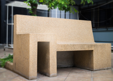 Outdoors garden sand stone chair, stock photoの写真素材