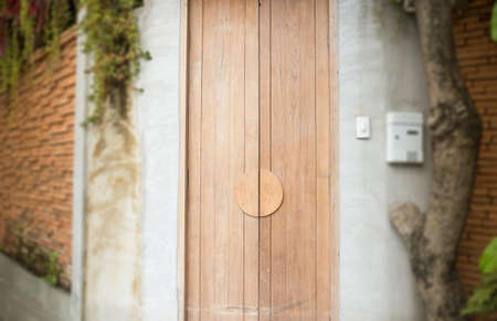 Vintage closed wooden door of house, stock photoの写真素材