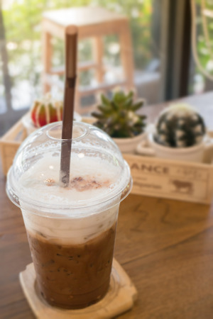 Iced coffee on wooden table, stock photoの写真素材