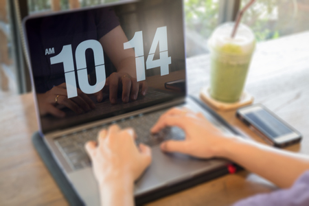 Woman using laptop in the coffee shop, stock photo