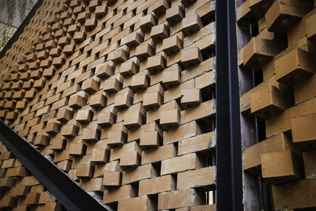 Brick wall and black iron in the garden, stock photo