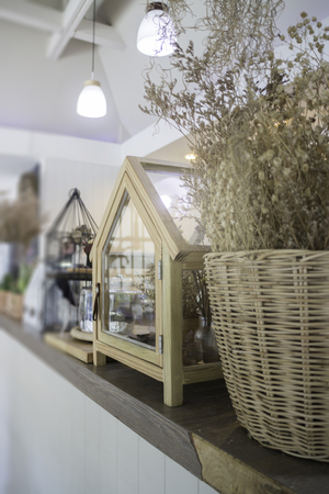 Dried little white flowers in basketの写真素材