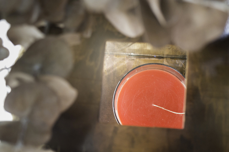 Red aroma candle in wooden box, stock photoの写真素材