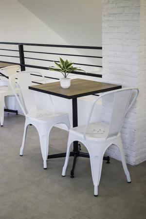 White steel chair and wooden table, stock photoの写真素材
