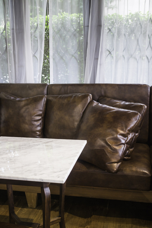 Leather brown sofa in living room, stock photoの写真素材