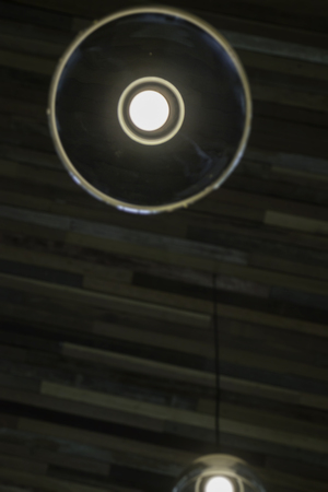 Vintage light bulbs hanging from ceiling, stock photoの写真素材