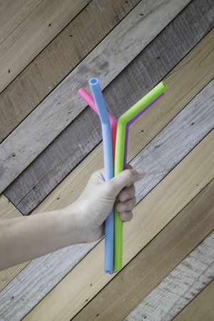Hand holding silicone drinking straw, stock photoの写真素材