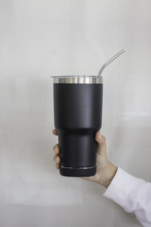 Hand on large water bottle for keeping temperature, stock photoの写真素材
