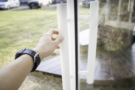 Hand on cargo container door, stock photoの写真素材
