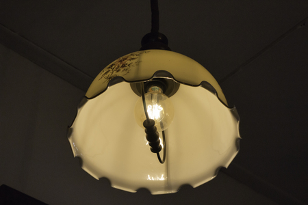 Decorative classic hanging lamp in cafe, stock photo