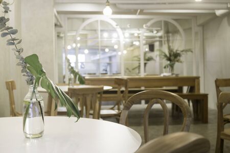 Cozy coffee shop with wooden furniture set, stock photo