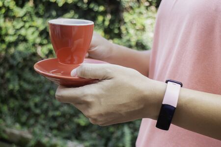 Healthy lifestyle concept female wearing sport tracker wristband arm, stock photo