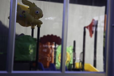 Children playground reflection on window glass, stock photoの写真素材
