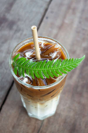 Coffee glass decorated with fern leaf, stock photoの写真素材