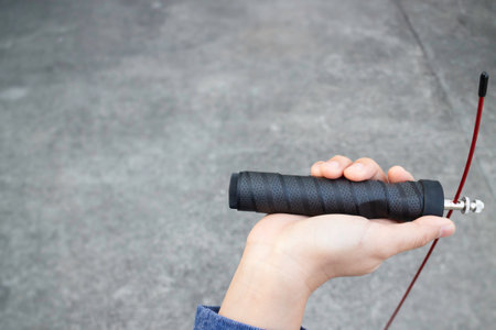 Hand of woman holding a speed jump rope, stock photoの写真素材
