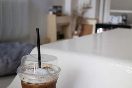A glass of iced coffee latte with art, stock photoの写真素材